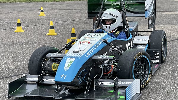 Colleague driving the track in the 2025 racing car