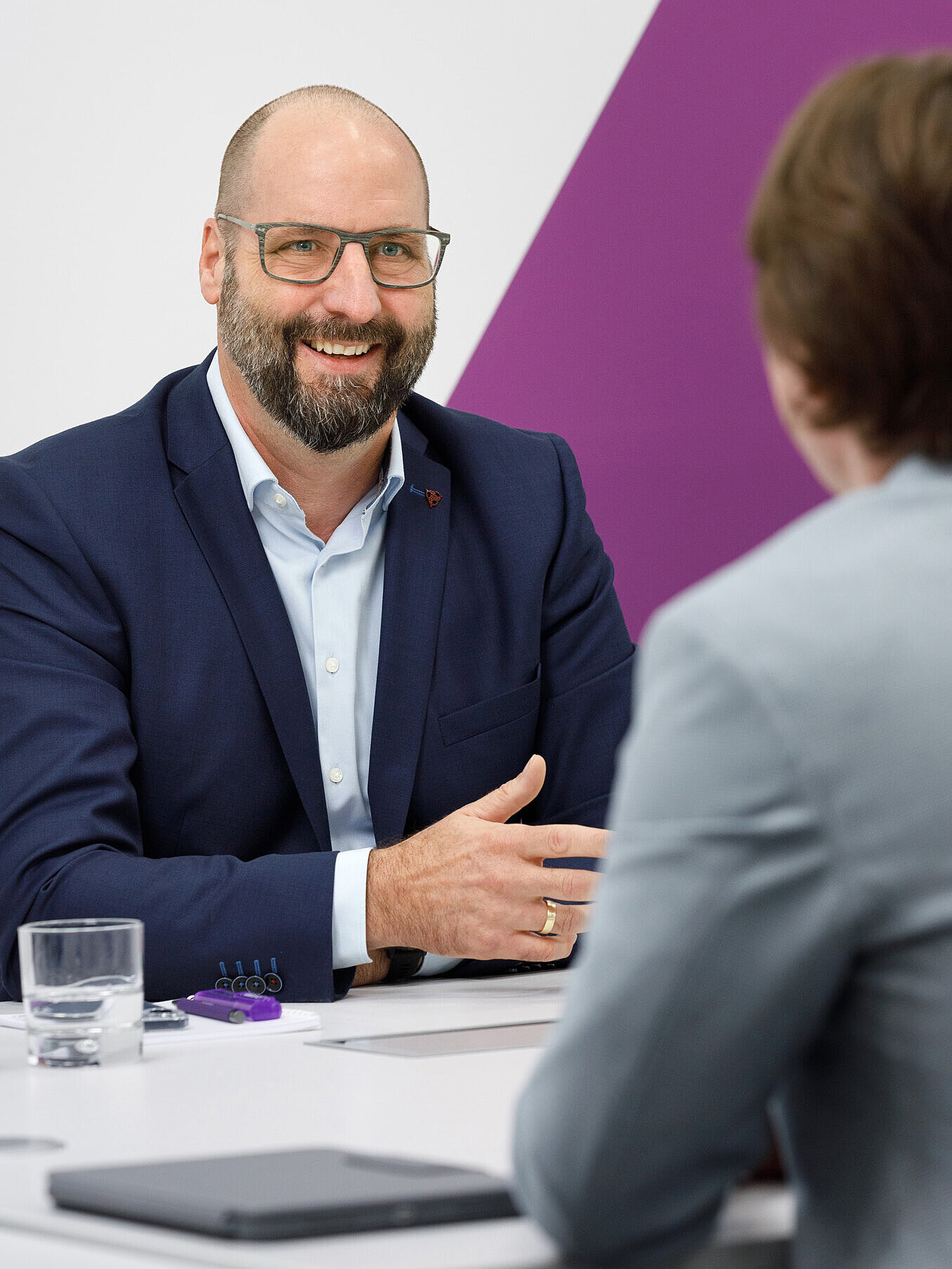 person laughing in a conversation with a professional
